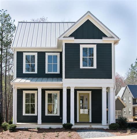 grey farm house with a blue metal roof|grey metal roof house.